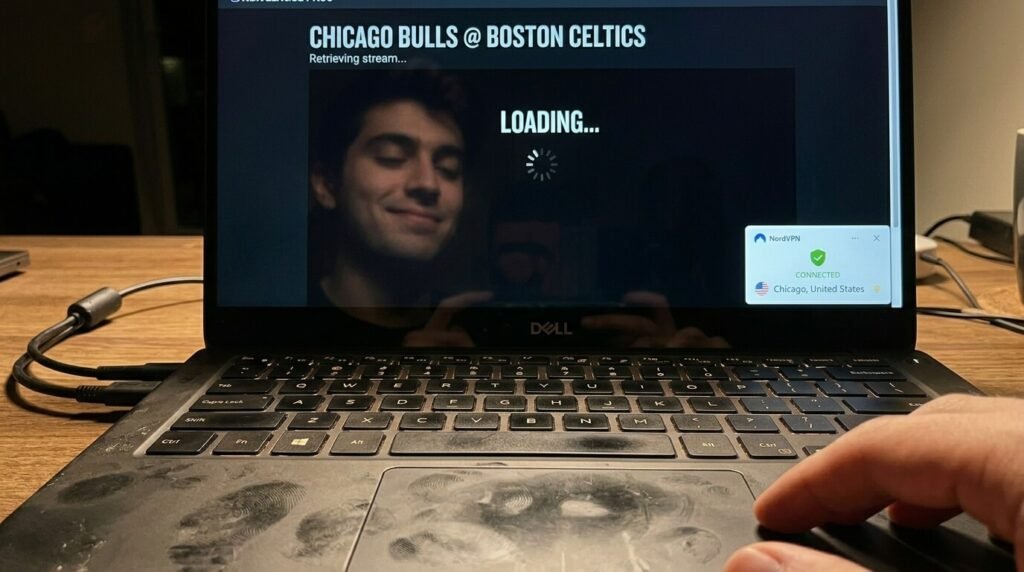 my thumbprint-smudged trackpad visible, faint reflection of my face looking relieved.